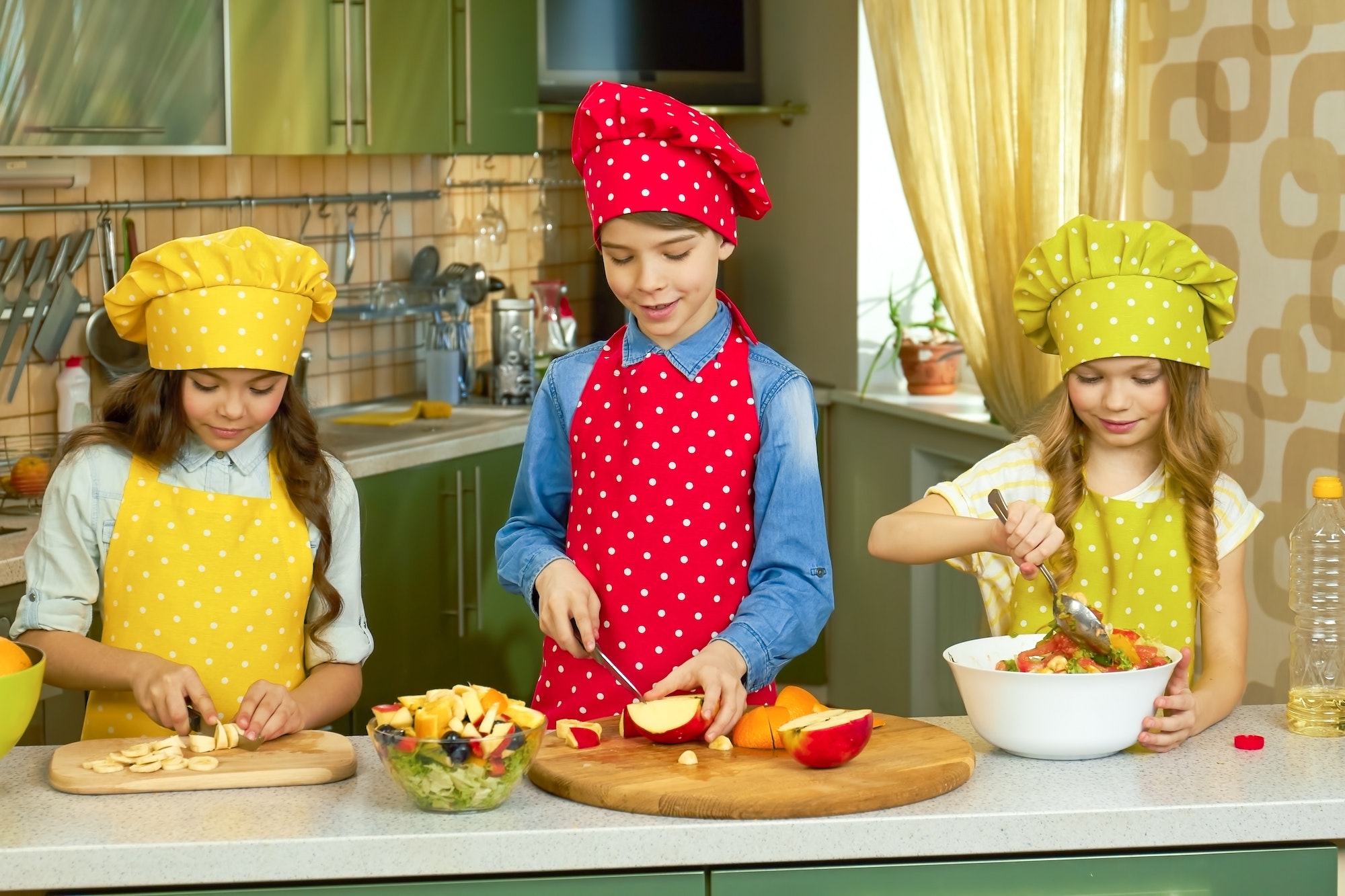 Three kids cooking
